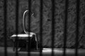 Conceptual jail photo with iron nail sitting behind bars artistic conversion Royalty Free Stock Photo