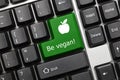 Conceptual keyboard - Be vegan green key with apple symbol