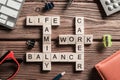 Conceptual keywords on wooden table with elements of game making crossword