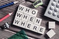 Conceptual keywords on wooden table with elements of game making crossword