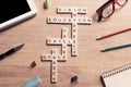 Conceptual keywords on wooden table with elements of game making crossword Royalty Free Stock Photo
