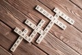 Conceptual keywords on wooden table with elements of game making crossword