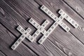 Conceptual keywords on wooden table with elements of game making crossword