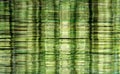 Abstract data storage image with layered stacks of translucent metallic green DVD and CD computer storage disks Royalty Free Stock Photo