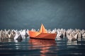 Conceptual leadership or success still life with origami boat. Royalty Free Stock Photo