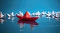 Conceptual leadership or success still life with origami boat. Royalty Free Stock Photo