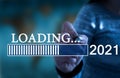 Conceptual message writing showing 2021 loading... Businessman using pen drawing 2021 loading... Royalty Free Stock Photo
