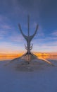 Conceptual metallic sculpture of the Viking boat from The Sun Voyager of the city of Reykjavik from behind and with a symmetrical