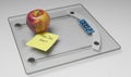 Conceptual and modern still life delicious apple and yellow posit note text saying start diet now stuck on bathroom scale in