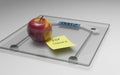 Conceptual and modern still life delicious apple and yellow posit note text saying stop sugar stuck on bathroom scale in weight