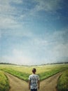 Conceptual painting with a doubtful person at a crossroad choosing the correct path between left and right. The road to success, Royalty Free Stock Photo