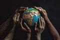 Conceptual peace symbol of african black hands making a circle together around the Earth globe against black background Royalty Free Stock Photo