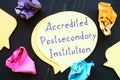 Conceptual photo about Accredited Postsecondary Institution with handwritten phrase