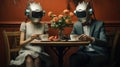 Conceptual photo of couple with robot heads, man and woman sitting at the table and drinking coffee