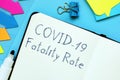 Conceptual photo about covid fatality rate with handwritten phrase Royalty Free Stock Photo