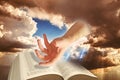 hand god divine arm bible open book heaven scripture almighty word sun rays sky skies Royalty Free Stock Photo