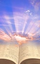 divine spiritual light open holy bible book sky skies sun rays clouds jesus christ jehovah gog heaven Royalty Free Stock Photo