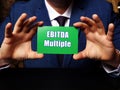 Conceptual photo about EBITDA Multiple with written phrase green business card