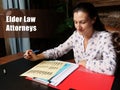 Conceptual photo about Elder Law Attorneys Businesswoman, executive manager hand filling paper business document