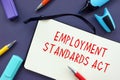 Conceptual photo about Employment Standards Act with handwritten phrase