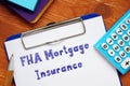 Conceptual photo about FHA Mortgage Insurance with handwritten text