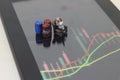 Top View Conceptual Photo, illustration for Senior Investor Mini Figure Toy businessman Seriously watching Running Stock Exchange