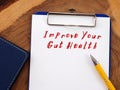 Conceptual photo about Improve Your Gut Health with handwritten text