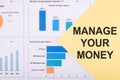 Conceptual photo about Manage Your Money with text on financial chart Royalty Free Stock Photo