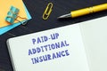 Conceptual photo about PAID-UP ADDITIONAL INSURANCE with handwritten phrase