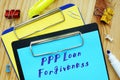 Conceptual photo about PPP Loan Forgiveness with handwritten text