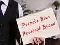 Conceptual photo about Promote Your Personal Brand with handwritten text