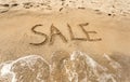 Conceptual photo of Sale written on sandy beach Royalty Free Stock Photo