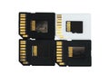 Conceptual photo of sd flash memory cards and micro SD lying on top of each other, isolate on a white background Royalty Free Stock Photo