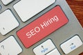 Conceptual photo about SEO Hiring  with handwritten phrase Royalty Free Stock Photo
