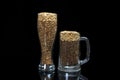 Conceptual photo simulates beer from dark and light malt in a beer glass