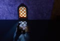 Conceptual Photo, Sitting Muslim, Islam People, Reading Al Quran at Mosque near Yellow Window, with blank space for area placement