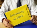 Conceptual photo about Succeeding at Work with written text