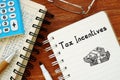 Conceptual photo about Tax Incentives with handwritten text