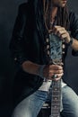 Gypsy hippie styled young man with guitar close up portrait Royalty Free Stock Photo