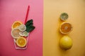 Conceptual photography. Citrus lemonade or juice from fresh fruits in a glass of tubules Royalty Free Stock Photo