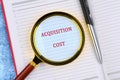 A conceptual phrase on the topic of ACQUISITION COST business. Business concept Royalty Free Stock Photo