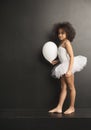 Conceptual picture of a little ballet dancer with a ballon