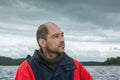 Conceptual Portrait Of A Pensive Bearded Man Against A Overcast Sky Royalty Free Stock Photo