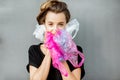 Conceptual portrait of a woman suffocating of plastic bags