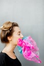 Conceptual portrait of a woman suffocating of plastic bags