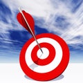 Conceptual red dart target board with arrow in the center on clouds Royalty Free Stock Photo