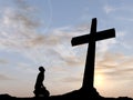 Conceptual religion cross with a man at sunset