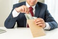 Conceptual shot of bribed politician taking envelope with money Royalty Free Stock Photo