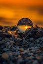 Conceptual shot with a glass lensball reflecting the sunrise ups Royalty Free Stock Photo