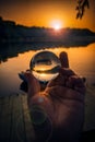 Conceptual shot with a hand holding a lensball used for reversed